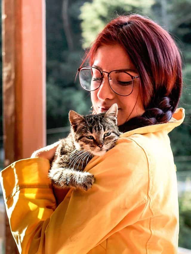 girl with cat in her hands